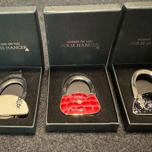 3 Foldable Purse / Handbag Hangers.Original box. Never used , gift condition